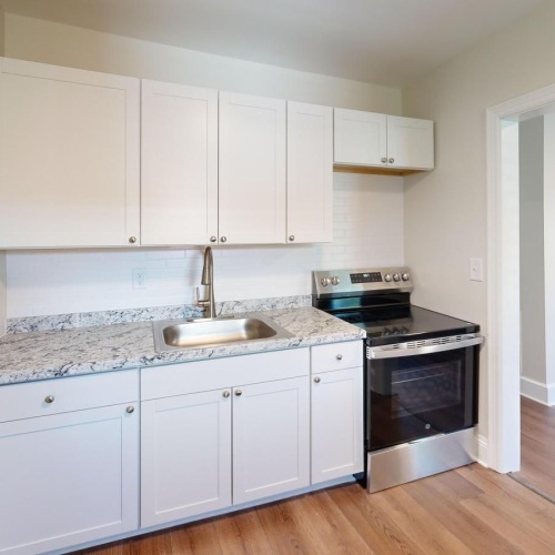 a kitchen with white cabinets