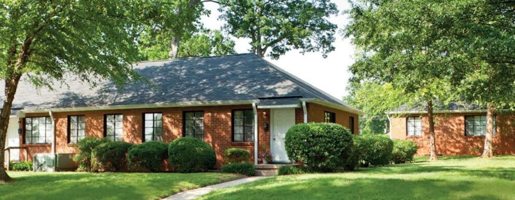 a brick house with a driveway